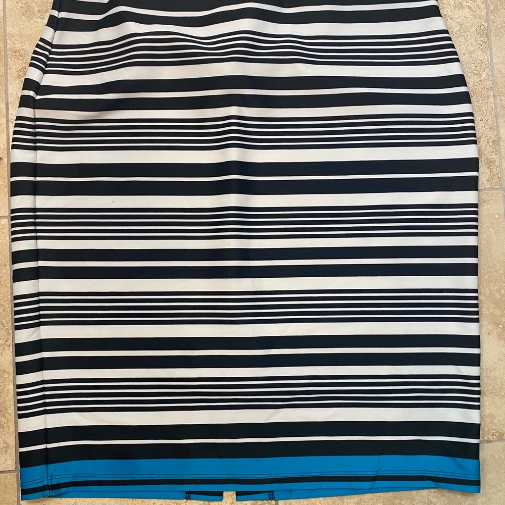 Black and white striped skirt with a turquoise stripe at the bottom